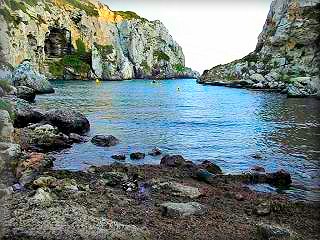 Covas coves or Cales Coves, famous for being a bastion of Naturism, nudism and hippies living in Menorca, the many caves were inhabited with people from all over Europe living naked across the creek and yachts